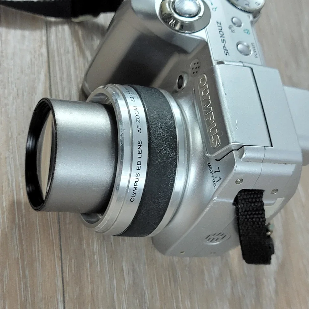 Olympus SP-510UZ 7.1 Megapixel Digital Camera 10x Optical Zoom Silver No Cap